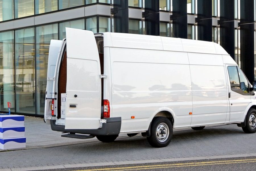 Courier van in a business district